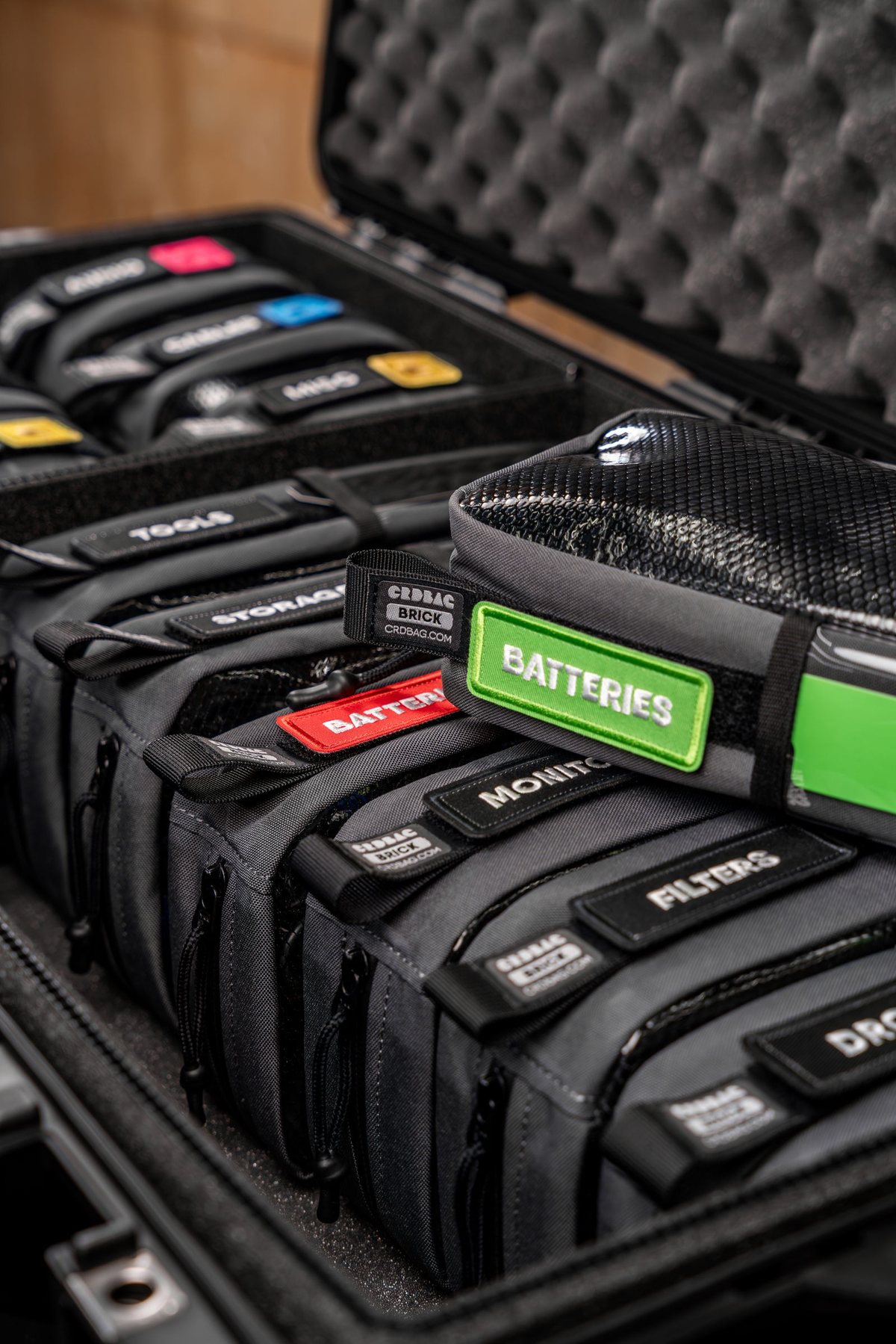Hard case with die-cut foam. Rigid shell plus die-cut EVA or EPE lining cut to the product outline
