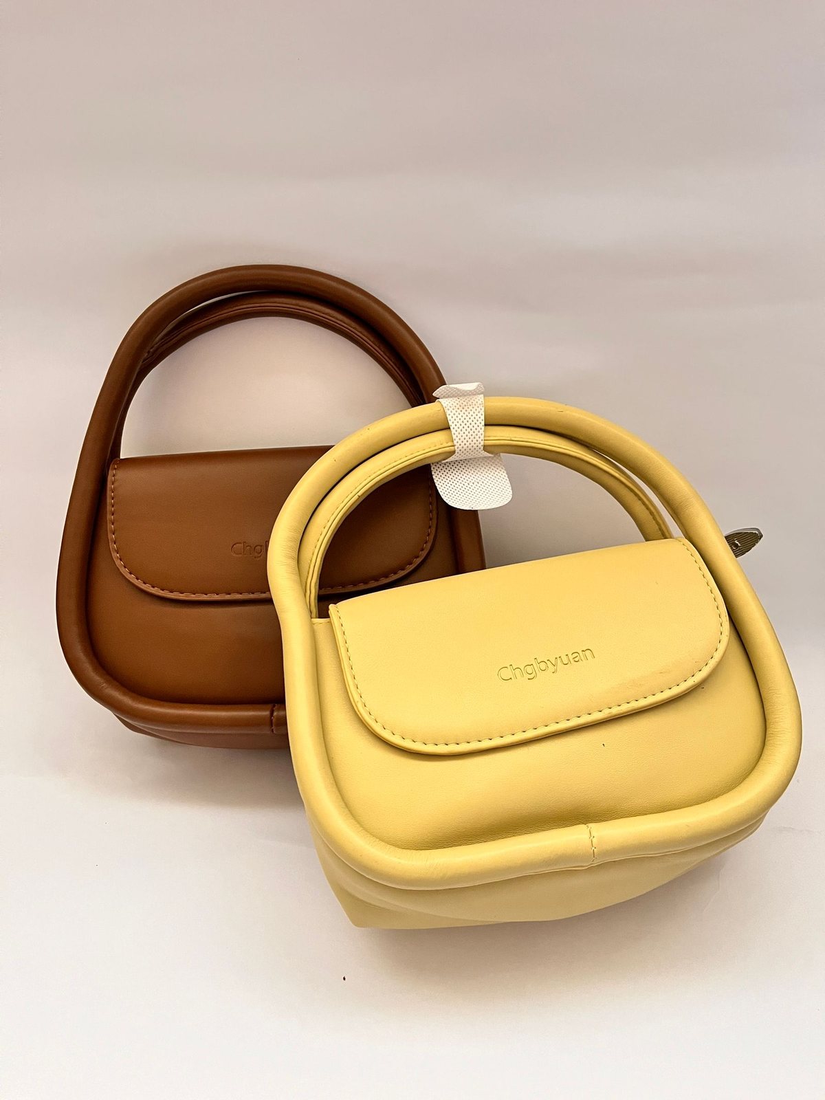 Shoulder bags - studio pair. Synthetic leather body, metal hardware, adjustable strap